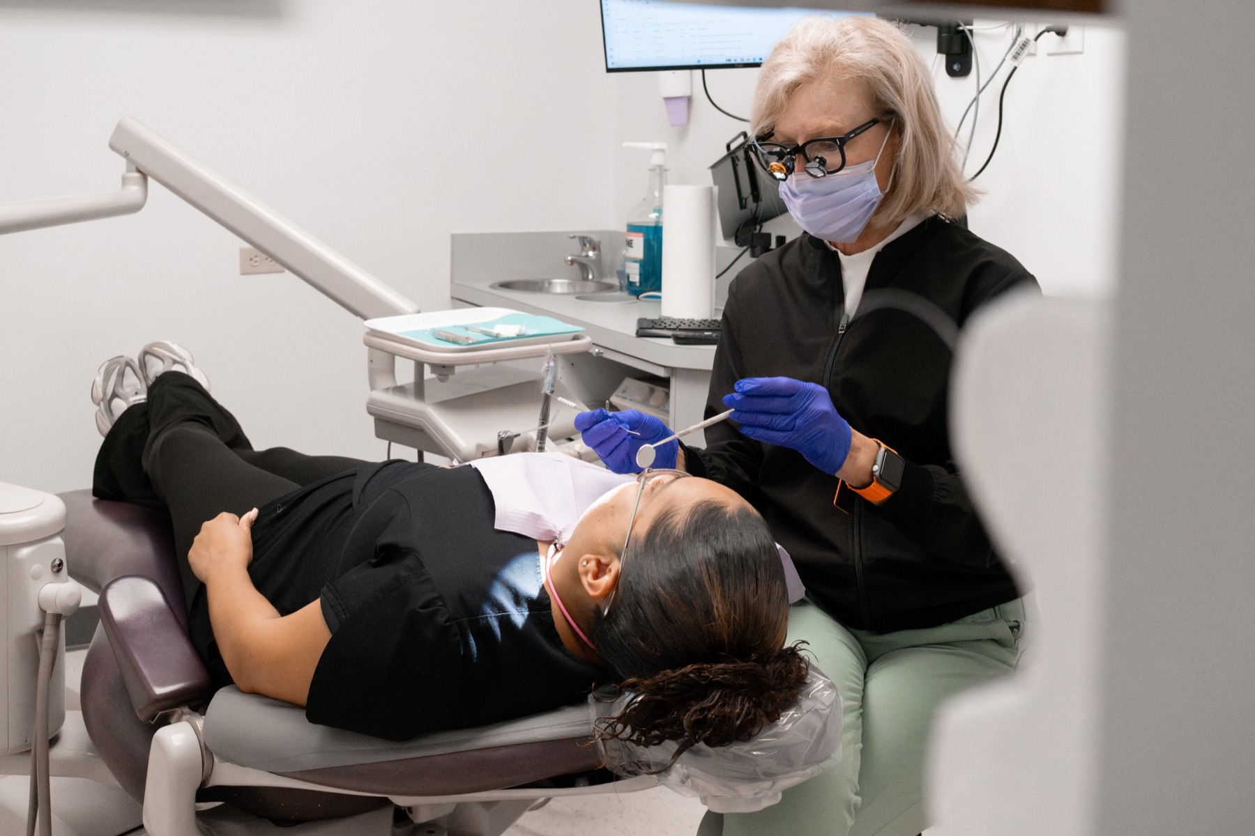 Patient receiving gentle care at Gardens Implant & Cosmetic Dentistry in Palm Beach Gardens