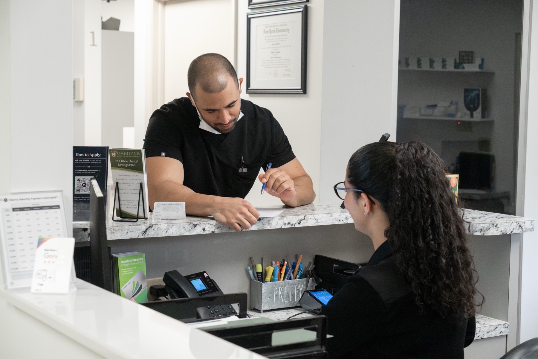 The team and office at Gardens Implant & Cosmetic Dentistry in Palm Beach Gardens, FL — slide 1 of 8
