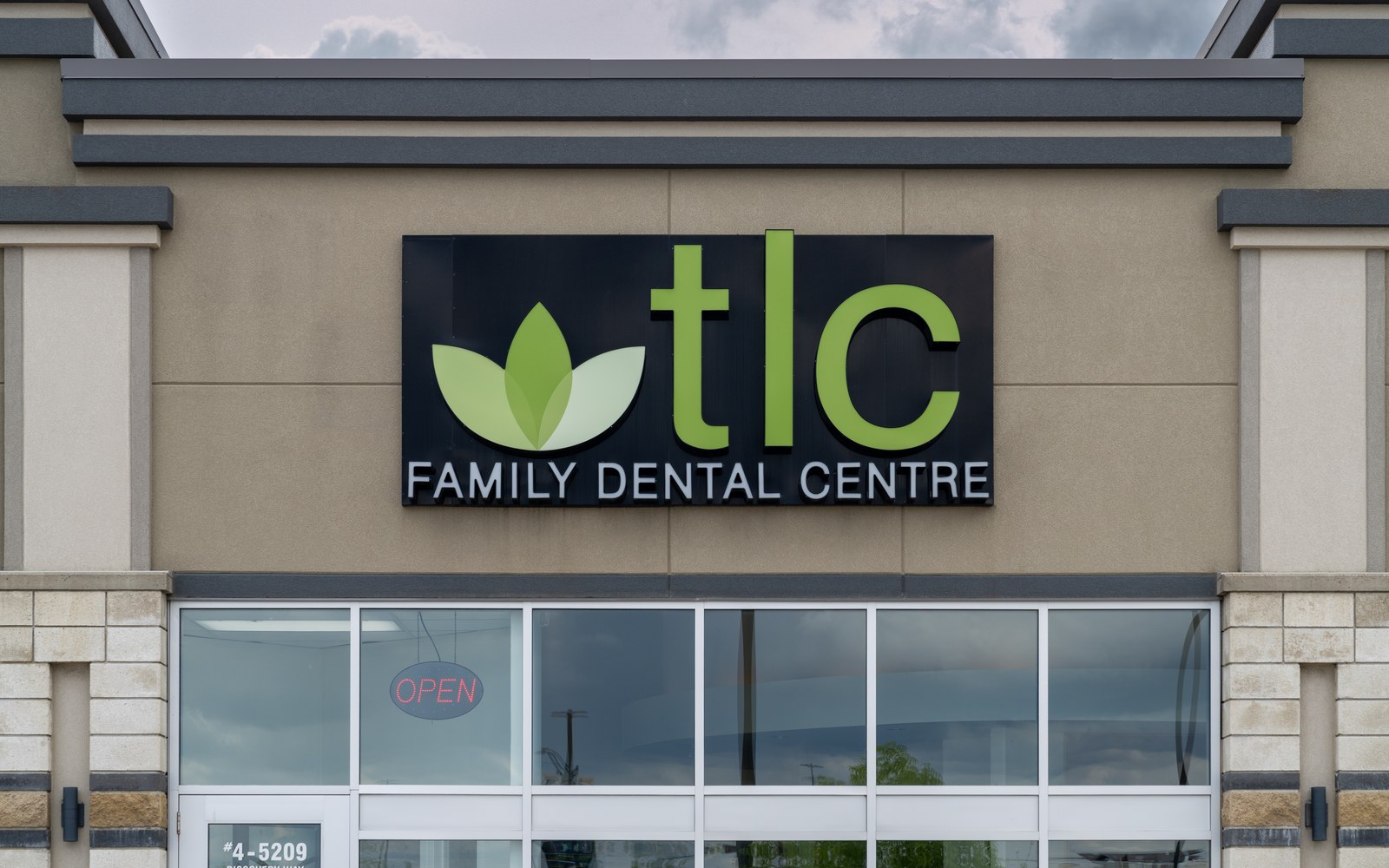 TLC Family Dental Centre exterior signage at 5209 Discovery Way in Leduc